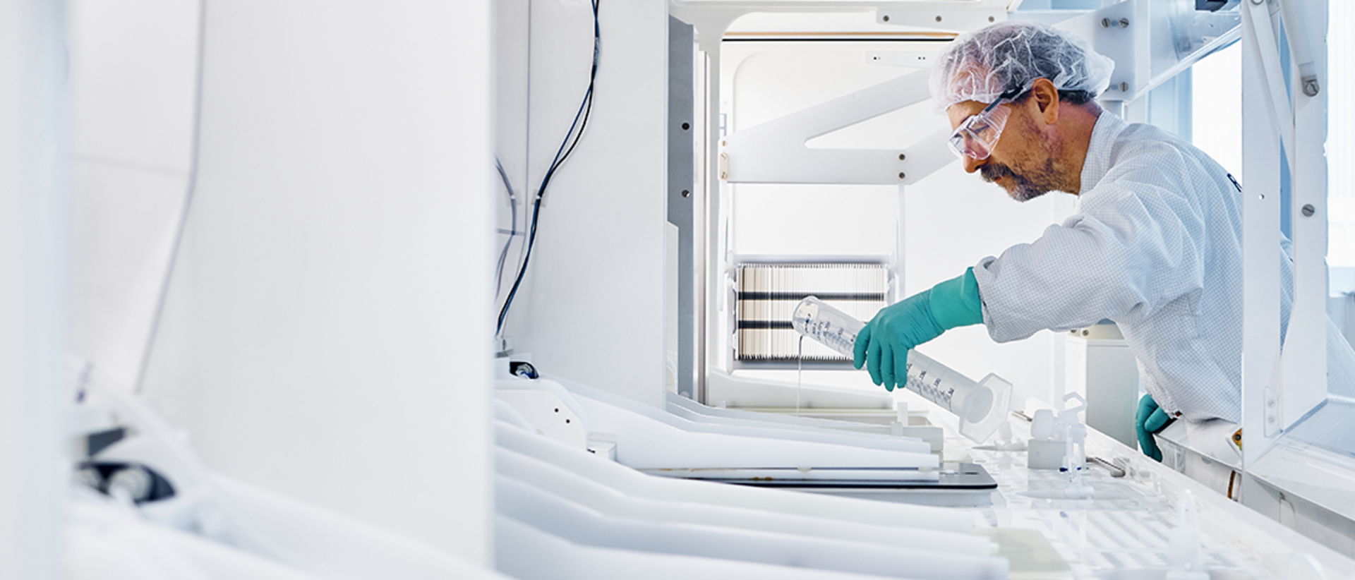 RENA employee working on a machine