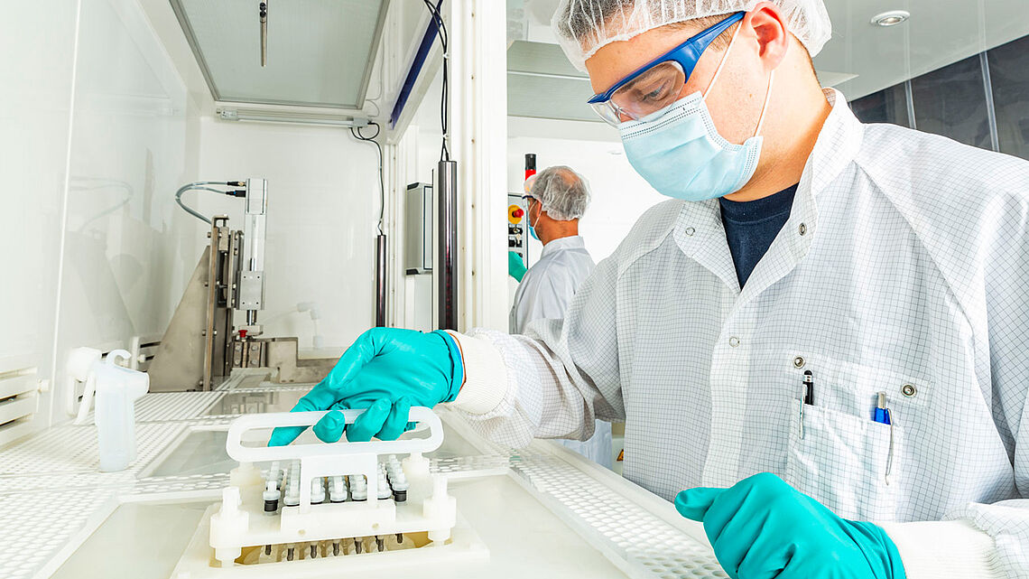 person handling dental implant etching