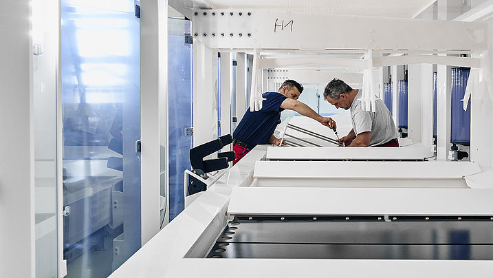 Mechanics working on machine